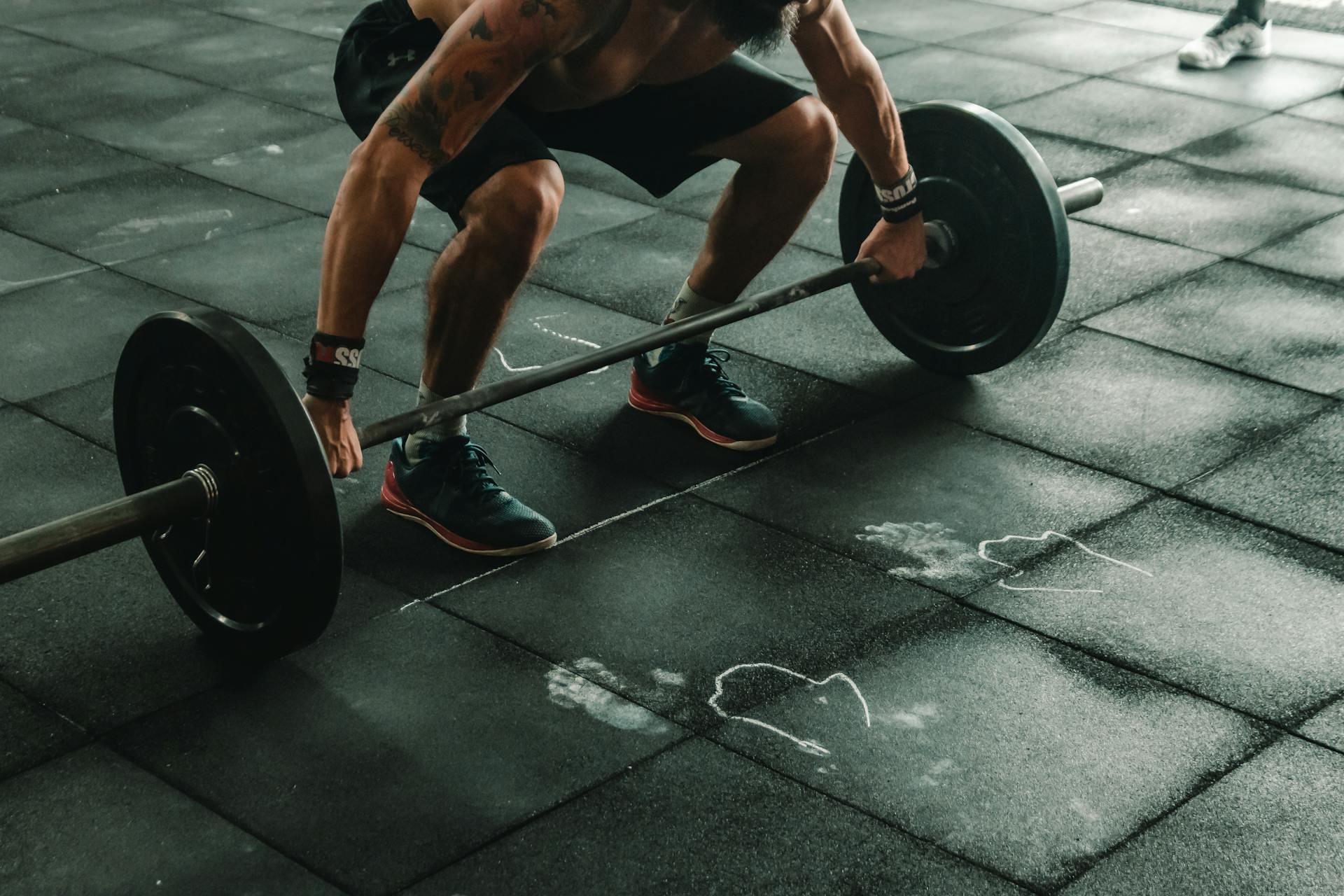 Man Lifting Weights in Gym