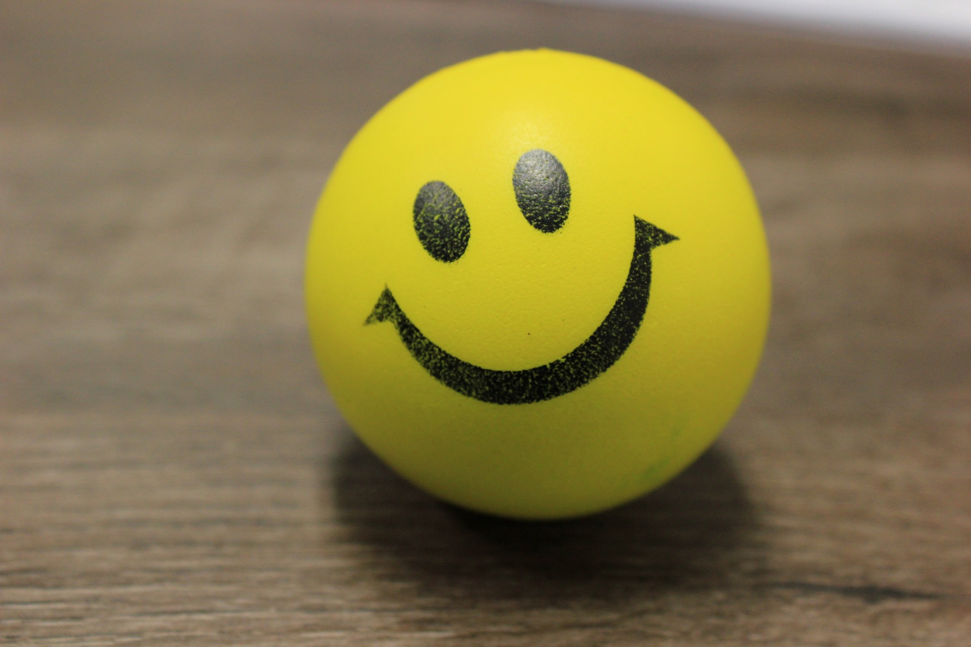 A smiley face on a brown table